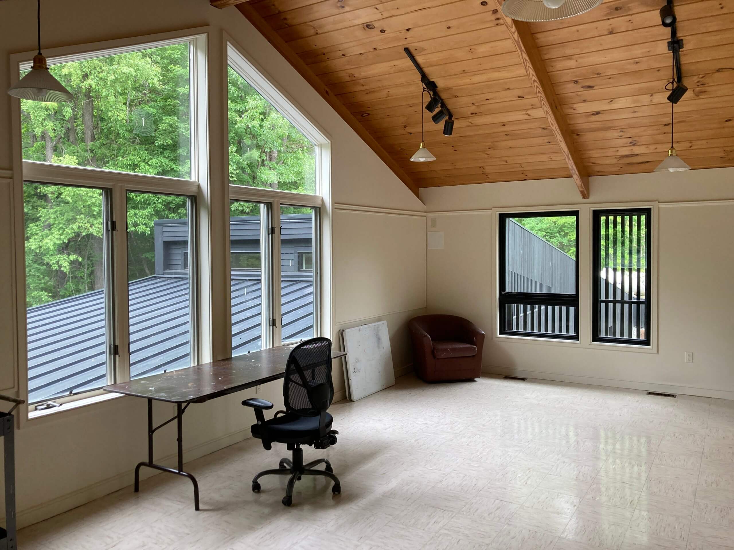 art studio with new addition seen through large windows