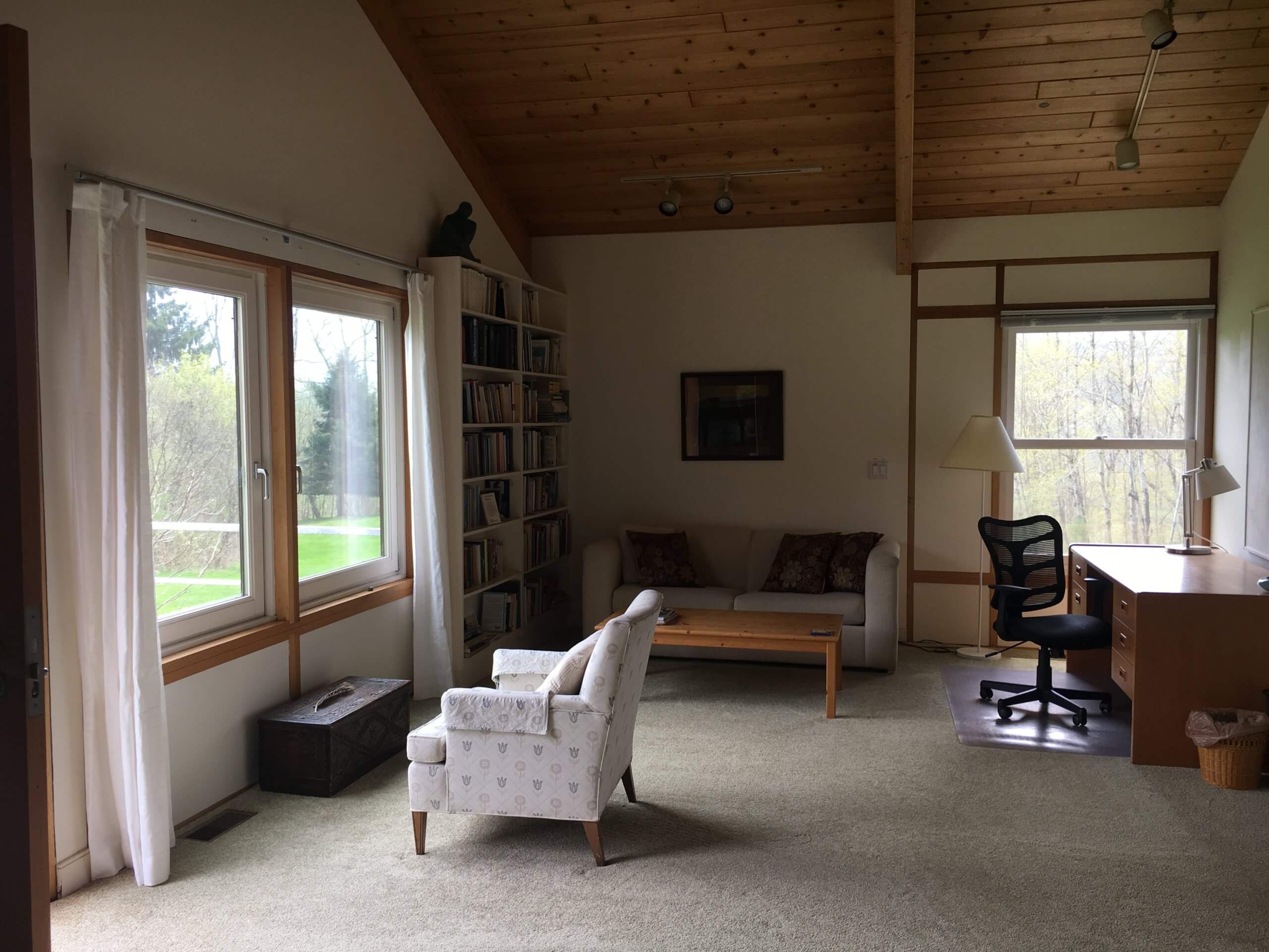 art studio with new addition seen through large windows